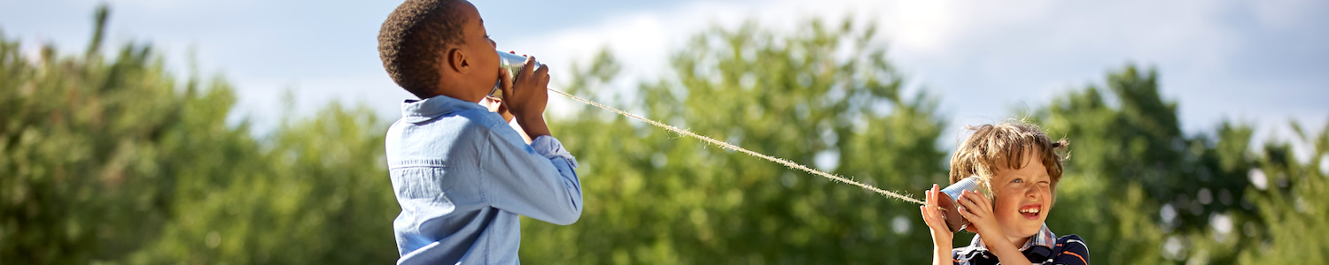 Boys with tin can and string telephone