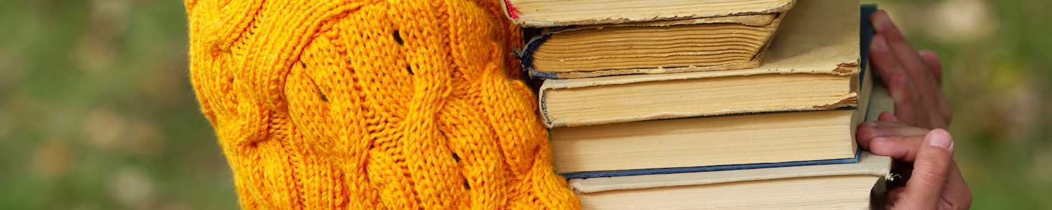 Image of person carrying books
