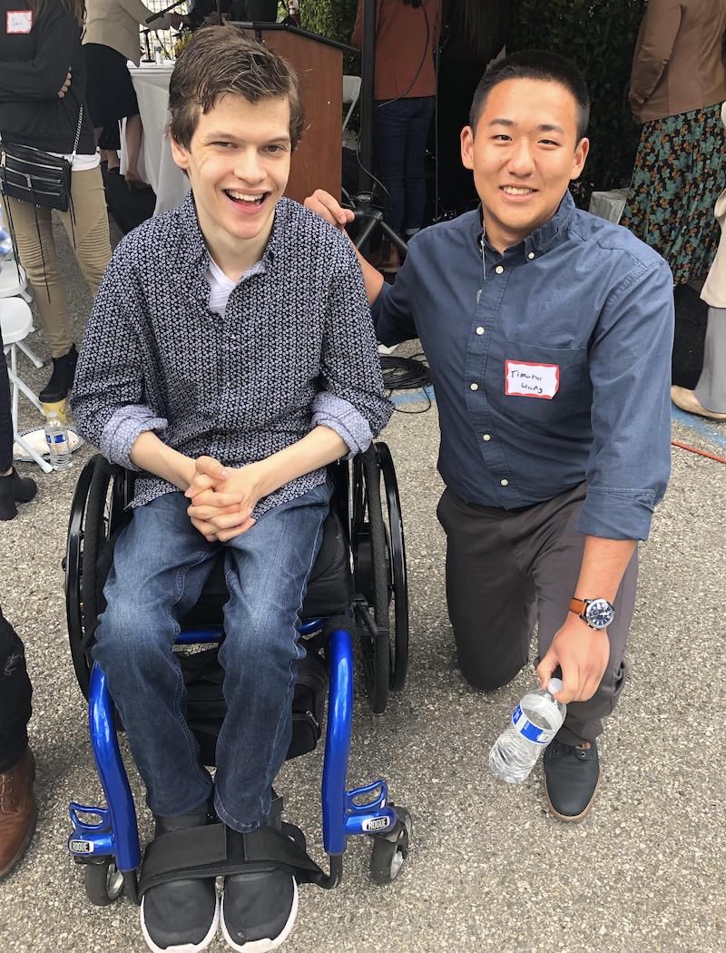 Wang (right) at an occupational therapy event where he got to meet the actor Micah Fowler from Speechless | Photo courtesy of Timothy Wang
