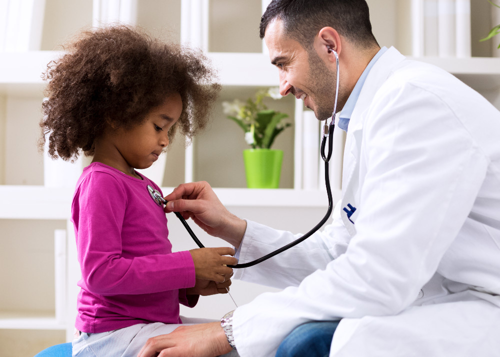 Stock photo of Black girl at physician office visit