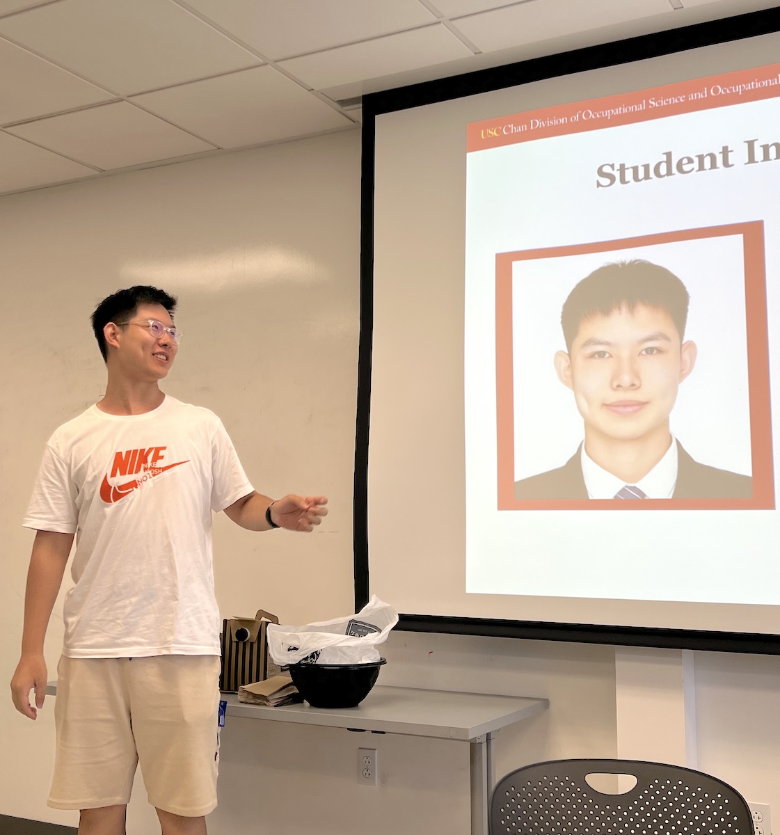 Cohort 3 student Yansong Li introduces himself to his peers and faculty