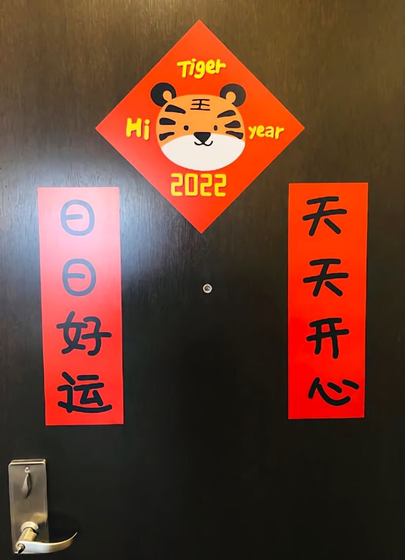 Lunar New Year decorations on the backside of the door — spring festival couplets.