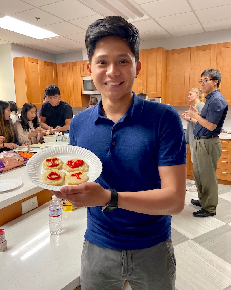 Japeth Dia, the student ambssador showing his finished product. The cookies say I love OT