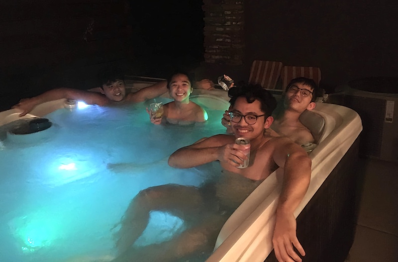 Just a group photo of those who are enjoying the hot tub.