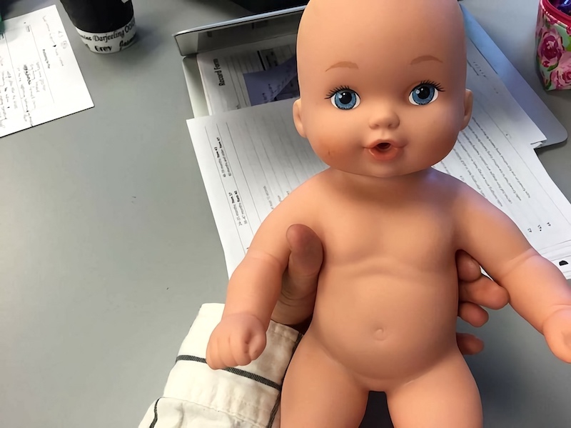 Photo of doll baby used to practice proper positioning in pediatrics lab