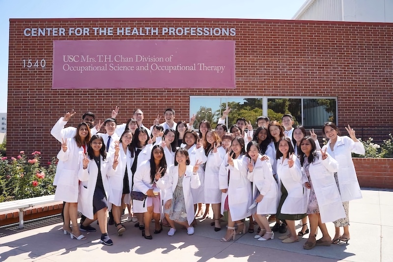 Class on white coat ceremony in front of the CHP building