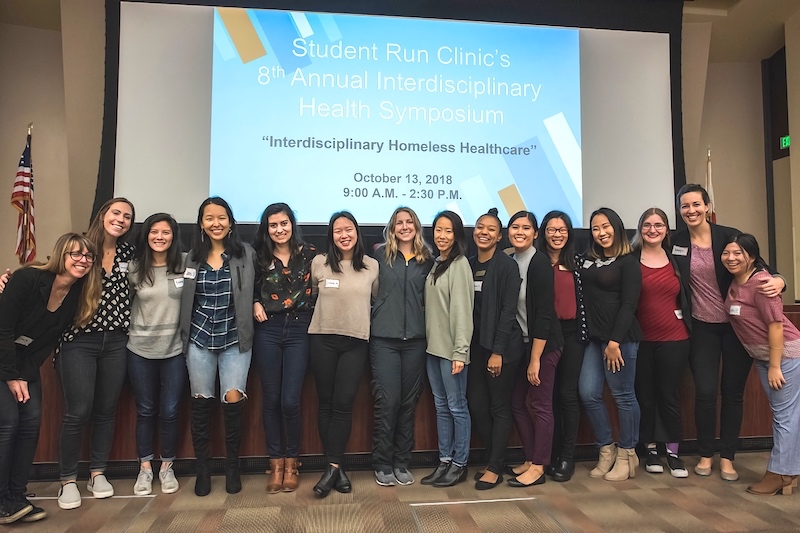 Occupational therapy students representing the profession at the Student Run Clinic's 8th Annual Interdisciplinary Health Symposium