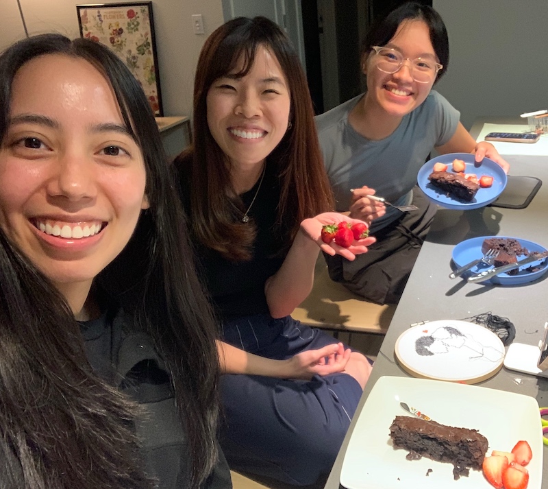 A picture of my housemates and I enjoying the brownies that we baked